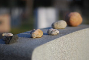 stones_or_pebbles_on_gravestone